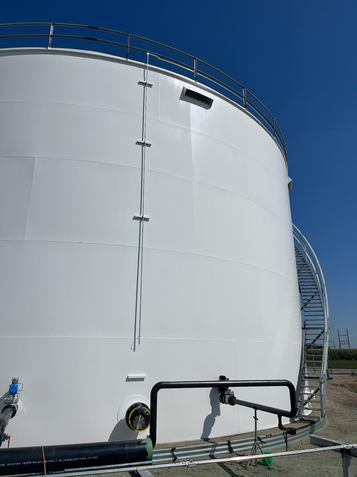A newly constructed steel ethanol storage tank is seen after its exterior is coated in a siloxane topcoat that inhibits fungal growth.