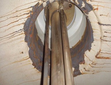 Corroded steel on the top side of a tank car interior. It is evidence of a lining failure due to poor application.