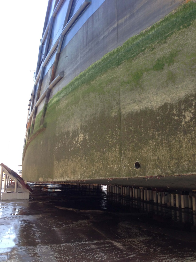 The hull of the ocean supply vessel Harvey Discovery is shown following a wash in 2014, revealing the condition of the coating.