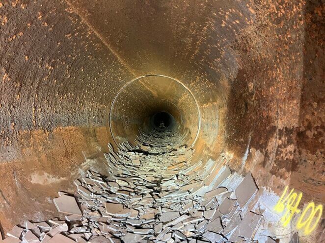 Heaps of broken mortar await transport out of the Etiwanda Pipeline in Southern California.