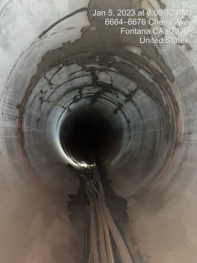 The inside of the Etiwanda Pipeline in Southern California is shown following abrasive blasting and prior to application of its new lining.
