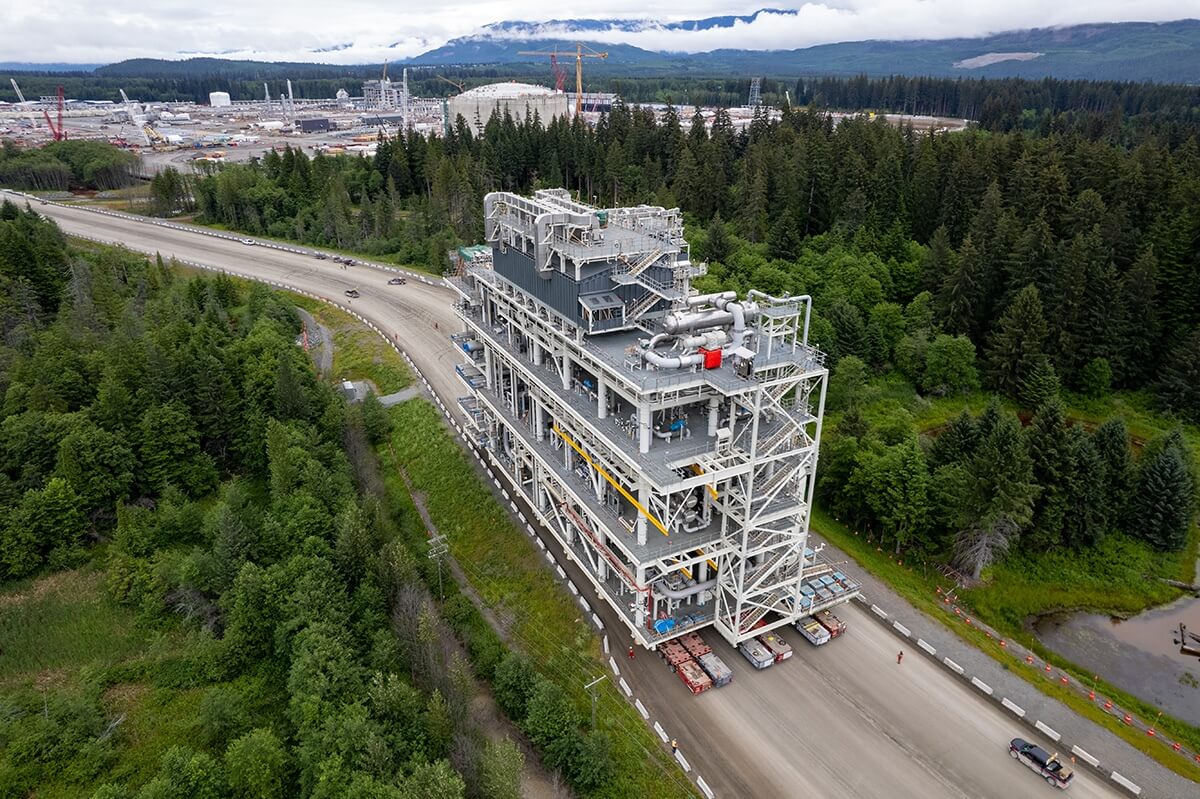 A module of the LNG Canada liquefied natural gas facility is hauled to the construction site on specialized flatbed trailers.