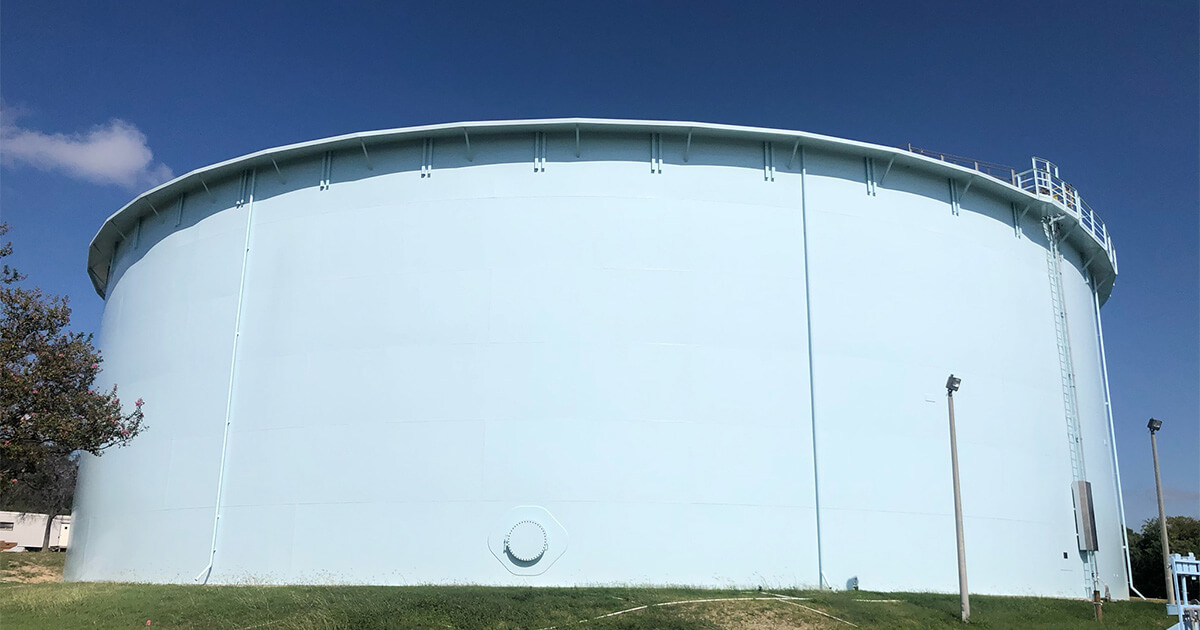 Sustainable coatings on a steel water storage tank exterior.