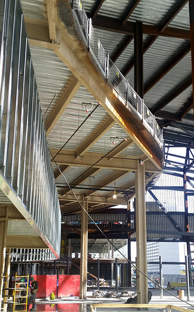 Low-density SFRM applied to structural columns and beams in a commercial sports arena