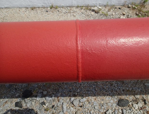 A close-up of a pipe exterior coated with Carboxane 2000.