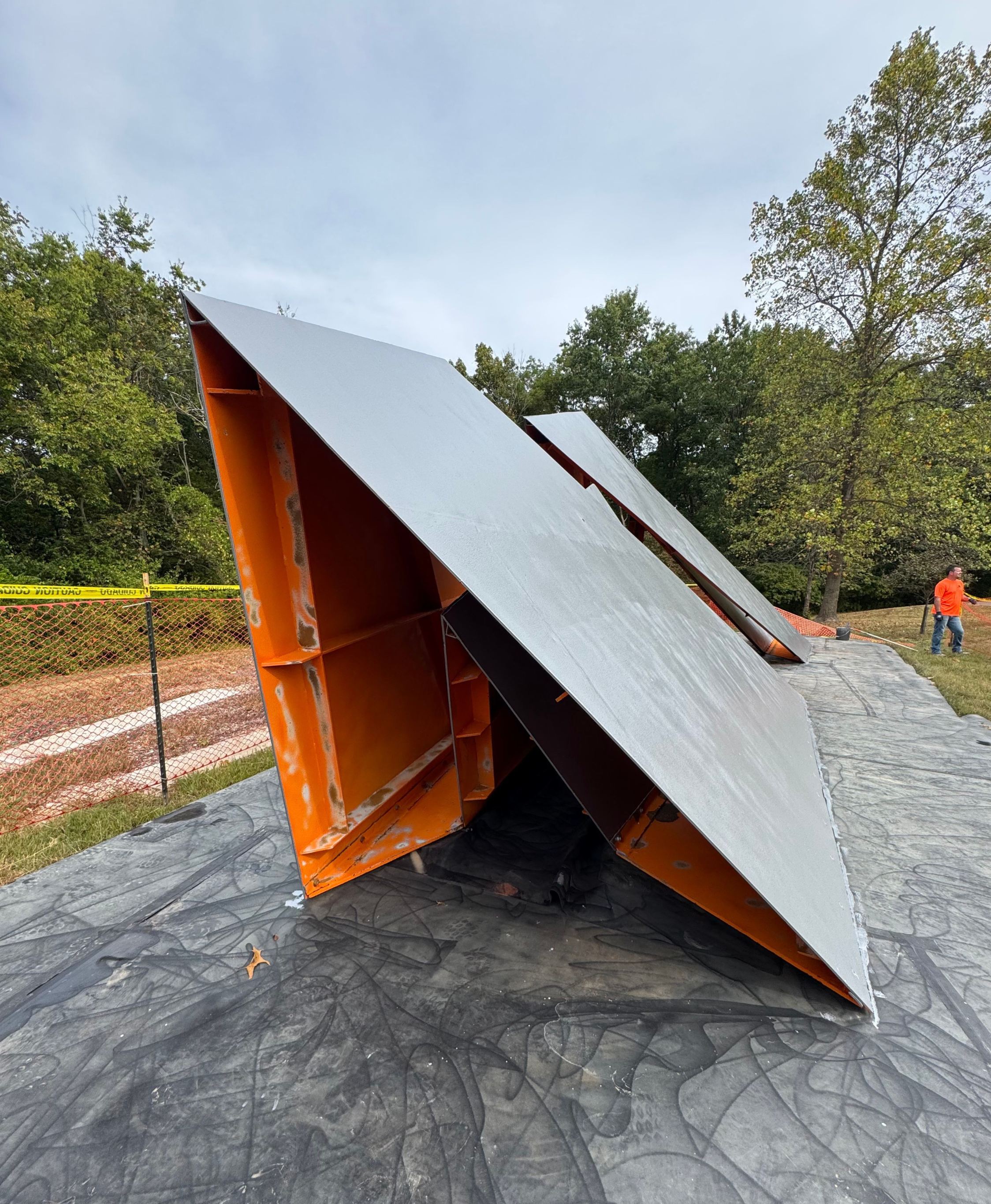 A large structure showing degradation on its underside and a blasted surface on top.