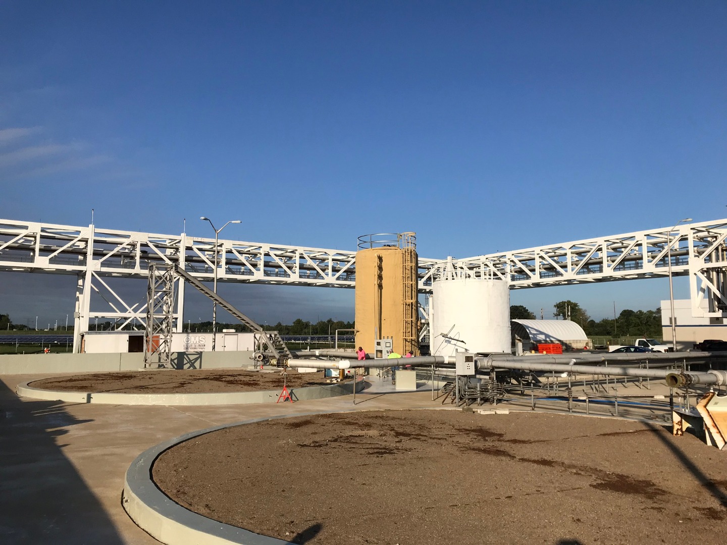  Secondary containment systems protecting aboveground storage tanks and process equipment at an industrial facility.
